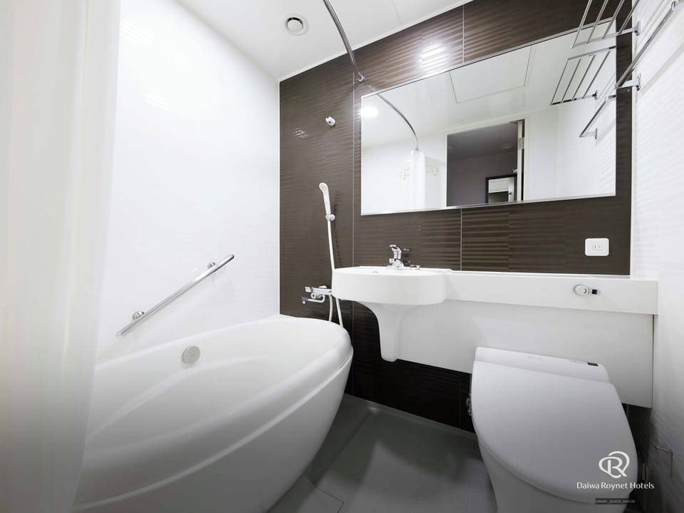 Combined shower/tub, free toiletries, hair dryer, slippers
