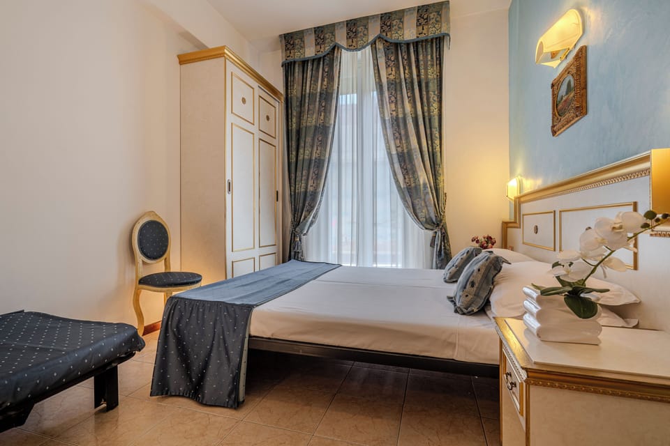 Triple Room | Minibar, in-room safe, desk, laptop workspace