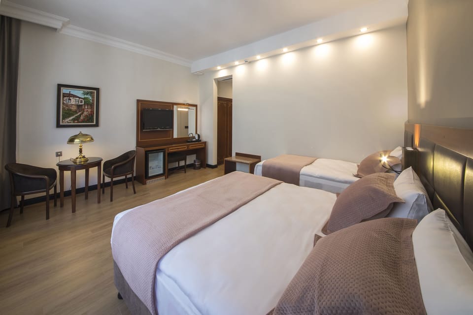 Superior Triple Room | Minibar, in-room safe, desk, soundproofing
