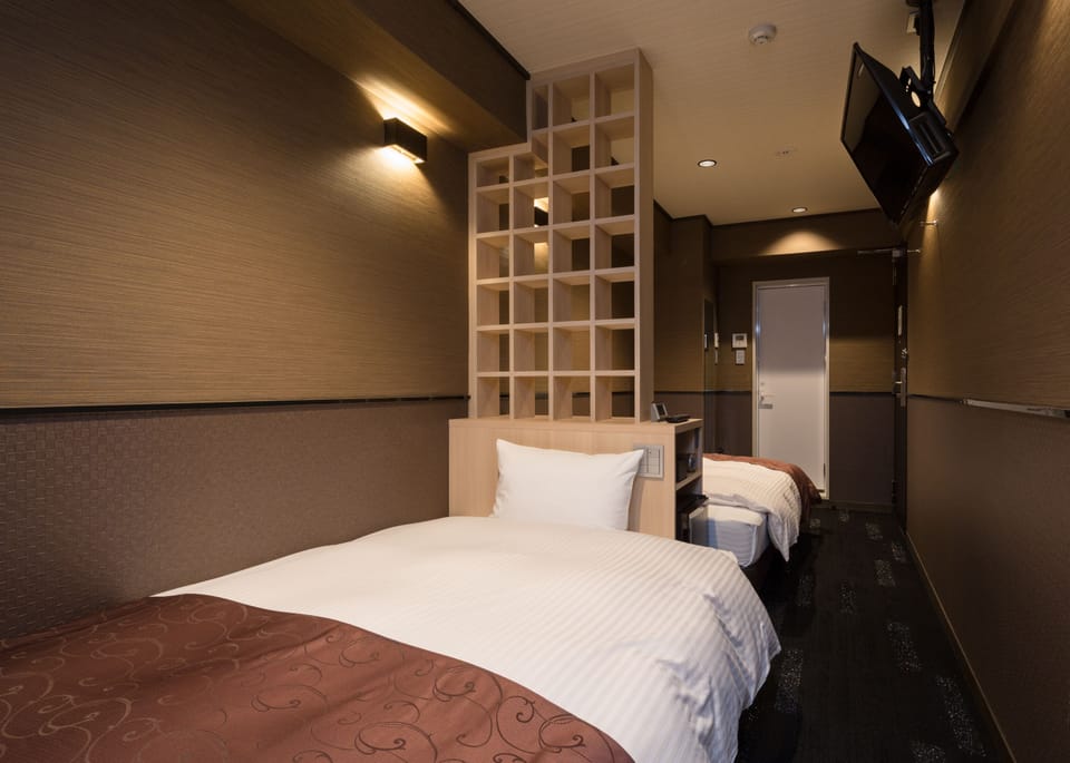 Twin Room | Premium bedding, down comforters, desk, free WiFi