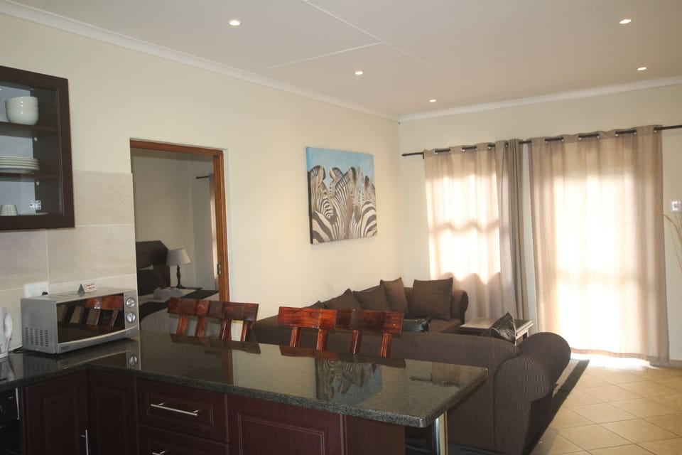 Family Self-catering Room | Living room | Flat-screen TV