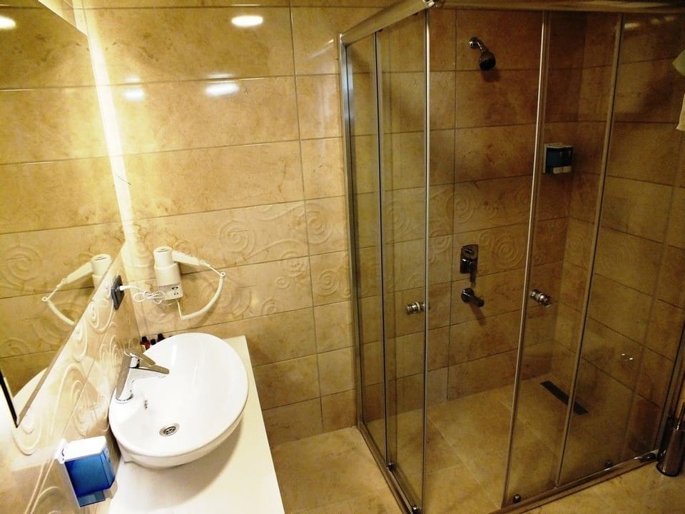 Shower, free toiletries, hair dryer, slippers