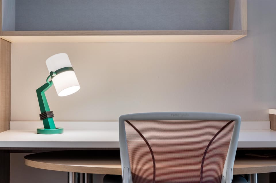 Hypo-allergenic bedding, pillowtop beds, desk, laptop workspace