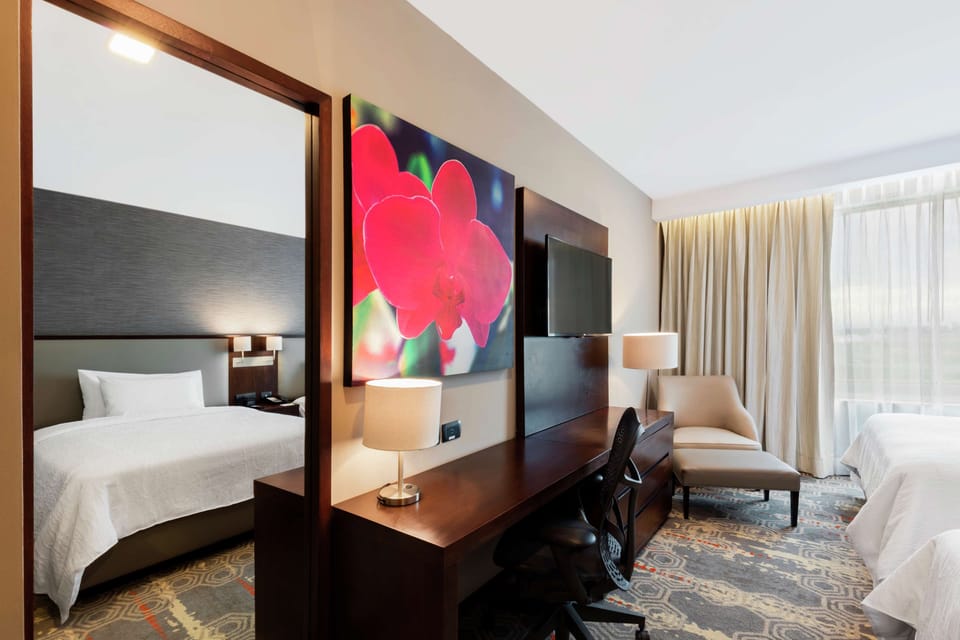 Premium bedding, in-room safe, blackout drapes, soundproofing