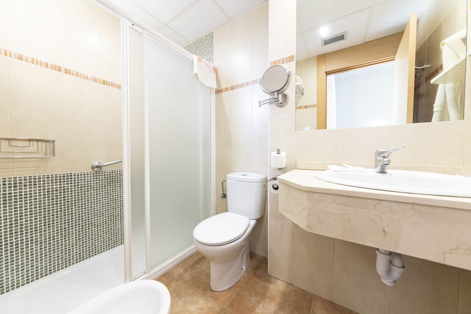 Shower, hair dryer, bathrobes, towels