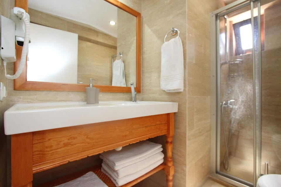 Shower, free toiletries, hair dryer, slippers