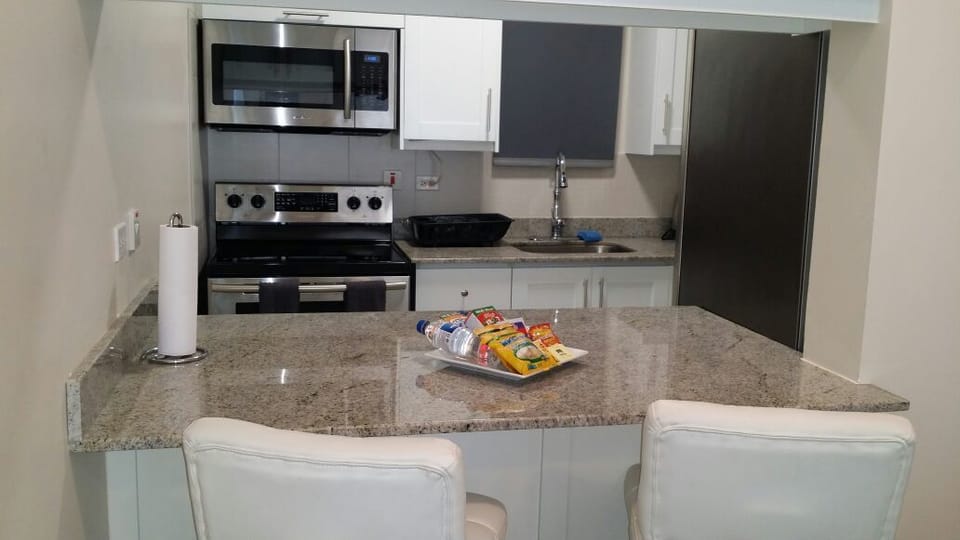 Room, 1 Queen Bed | Private kitchen | Full-size fridge, microwave, oven, stovetop