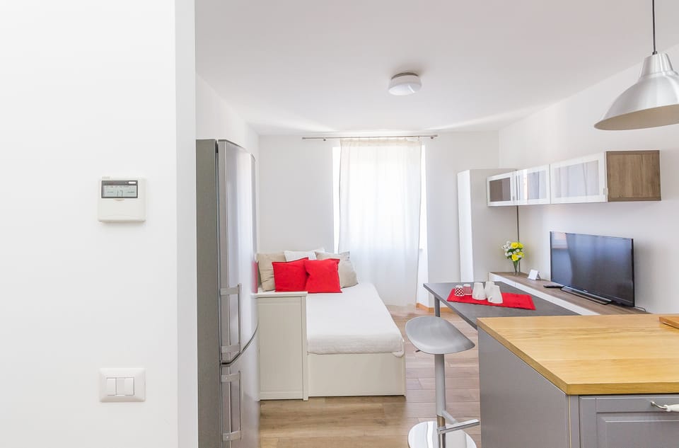 Apartment, 1 Bedroom | Living area | 40-inch flat-screen TV with digital channels, TV