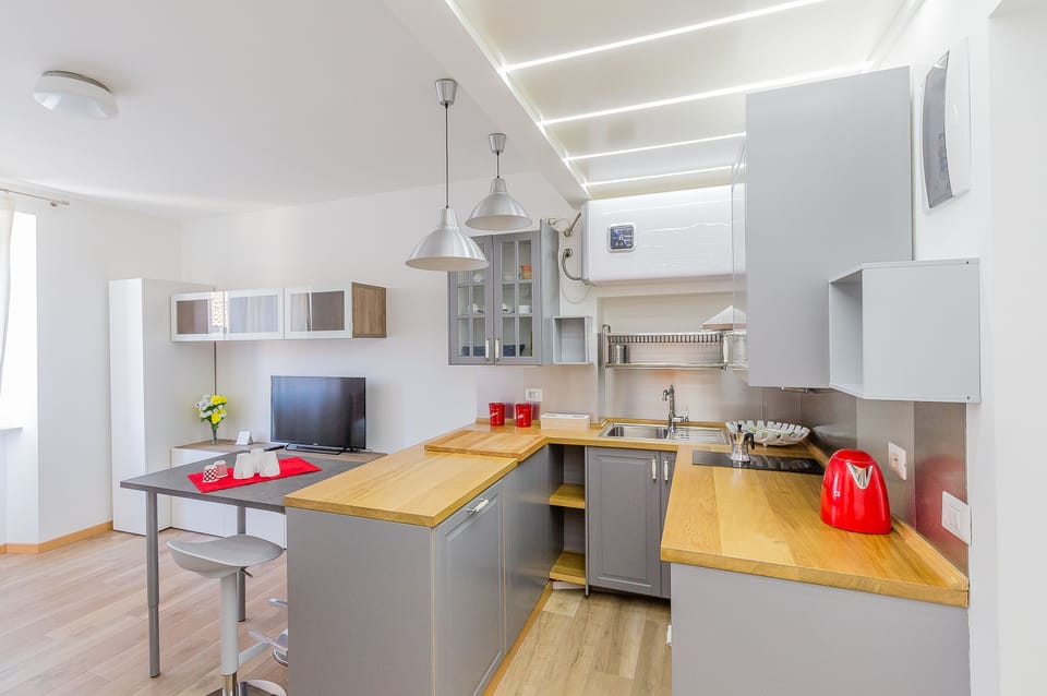 Apartment, 1 Bedroom | Private kitchen | Full-size fridge, microwave, stovetop, dishwasher