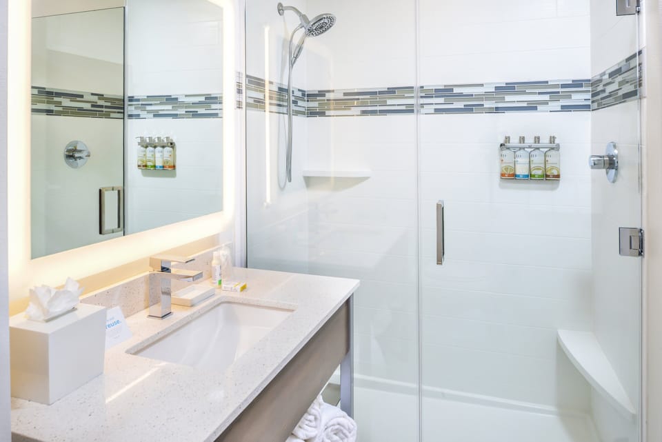 Designer toiletries, hair dryer, towels, soap