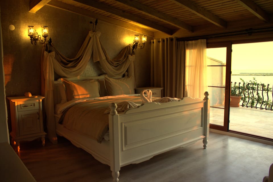 Deluxe Double Room, Balcony, Sea View | Premium bedding, minibar, in-room safe, iron/ironing board