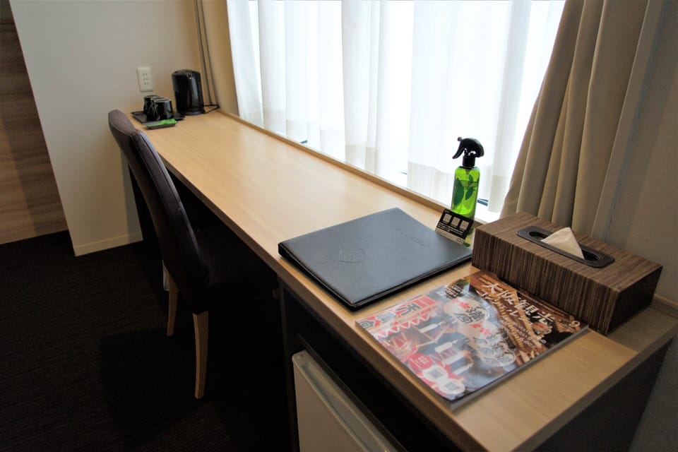 Desk, blackout drapes, WiFi (free), bed sheets