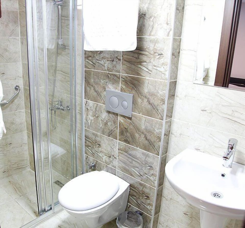 Shower, free toiletries, hair dryer, slippers