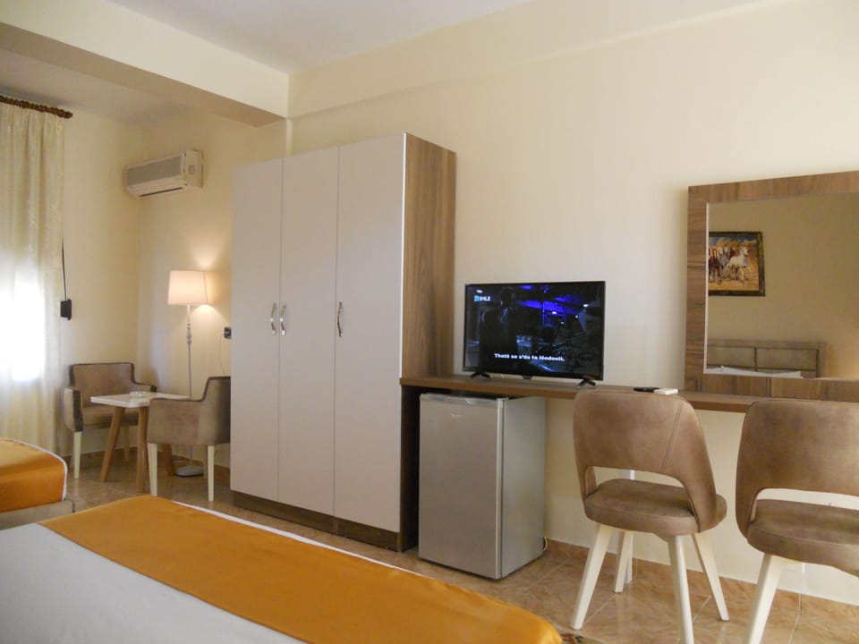 Triple Room, 1 Bedroom, Non Smoking, Side Beach View | Desk, iron/ironing board, free WiFi, bed sheets