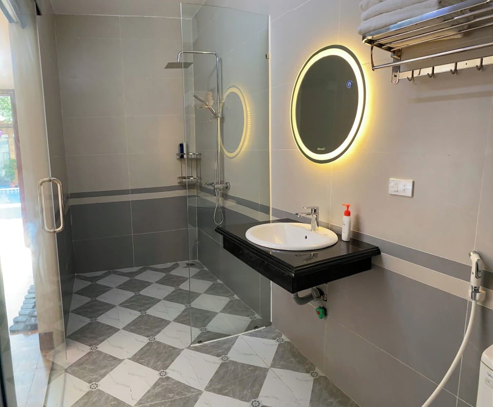 Shower, rainfall showerhead, designer toiletries, hair dryer