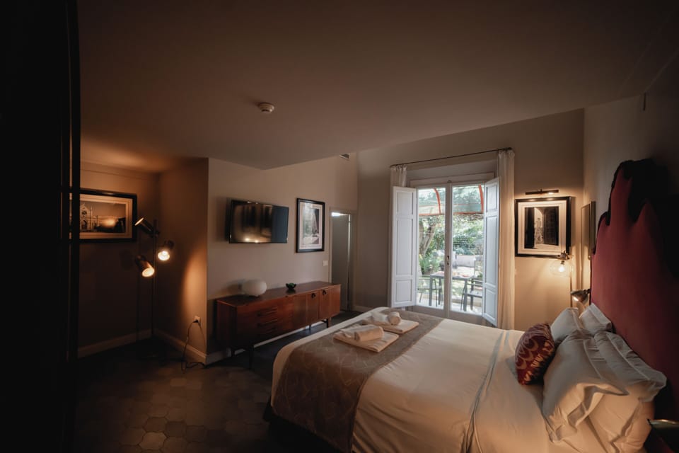 Family Room, Garden View | Pillowtop beds, minibar, in-room safe, desk