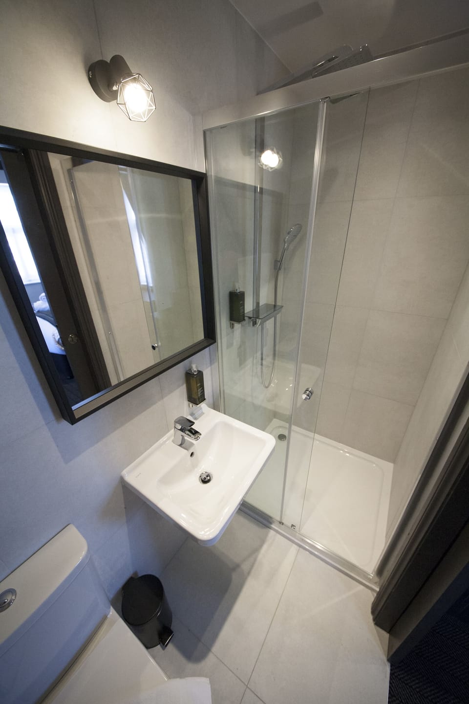 Shower, designer toiletries, hair dryer, towels