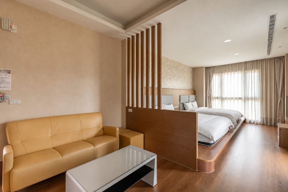 Deluxe Family Room | Down comforters, blackout drapes, WiFi (free), bed sheets