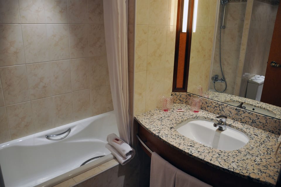 Deep soaking tub, eco-friendly toiletries, hair dryer, towels