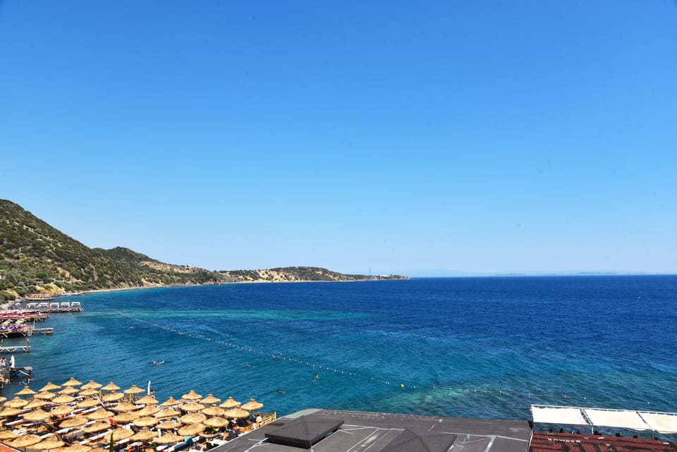 On the beach, sun loungers, beach umbrellas