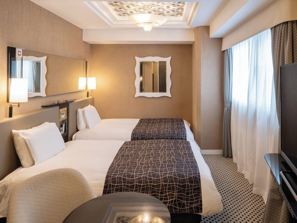 Deluxe Twin Room, Non Smoking | Premium bedding, down comforters, desk, blackout drapes