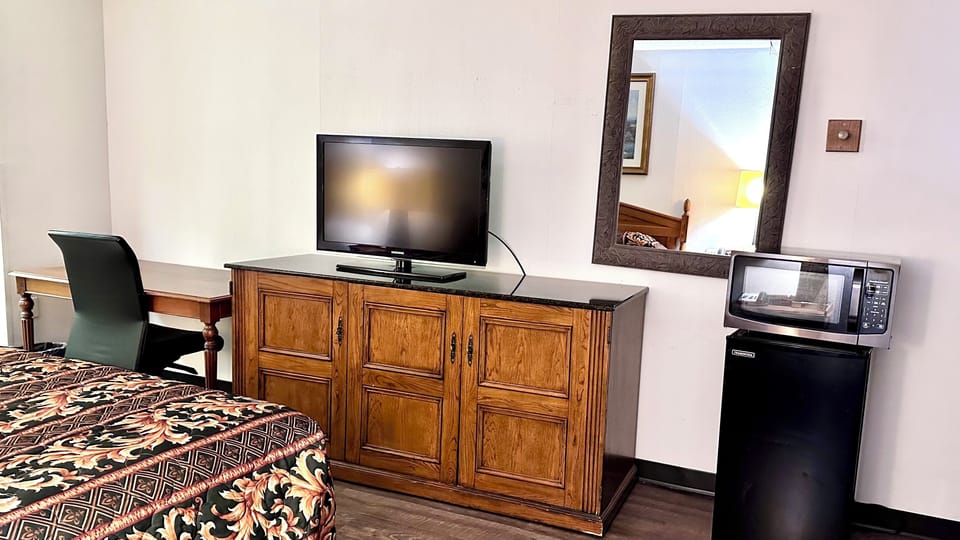 40-inch TV with cable channels, pay movies