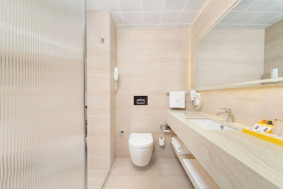 Free toiletries, hair dryer, slippers, towels