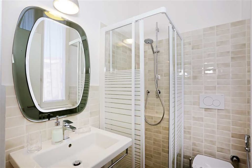 Quadruple Room | Bathroom | Shower, free toiletries, hair dryer, towels