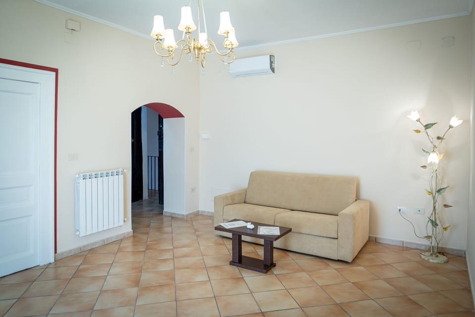 Deluxe Suite, Hill View | Living room | 60-inch TV with digital channels