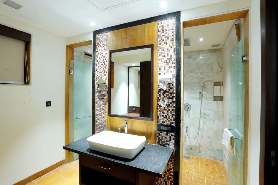 Shower, rainfall showerhead, designer toiletries, hair dryer