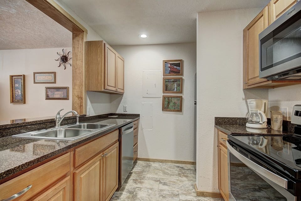 Condo, 2 Bedrooms | Private kitchen | Coffee/tea maker, full-size fridge, microwave, oven