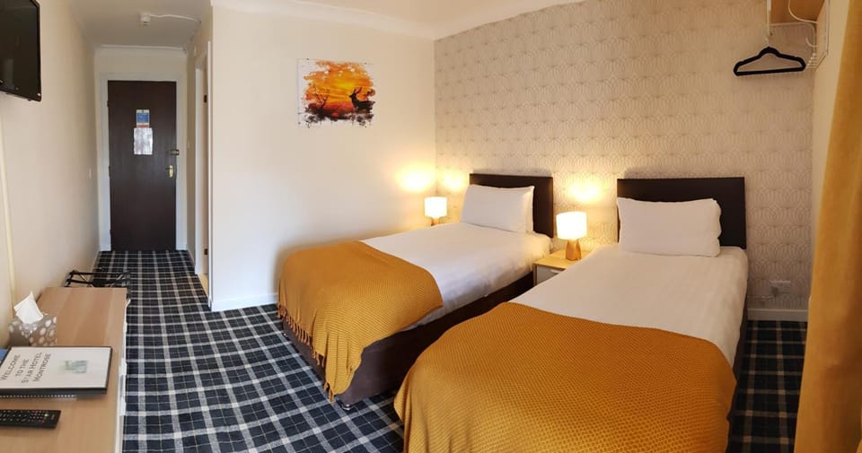 Desk, laptop workspace, blackout drapes, iron/ironing board