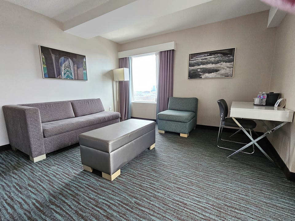 Deluxe Room, 2 Queen Beds (Deluxe Family Suite) | Living area | 49-inch flat-screen TV with satellite channels, TV