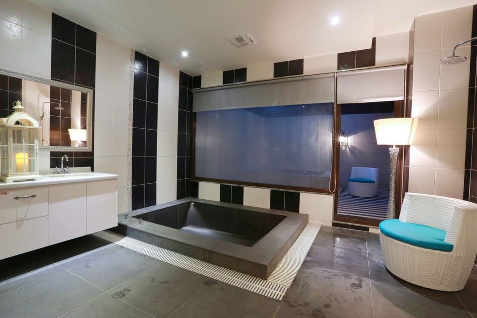Deluxe Quadruple Room, Multiple Beds (Due to safety concerns, minimum occupancy 2 people) | Bathroom | Separate tub and shower, free toiletries, hair dryer, slippers