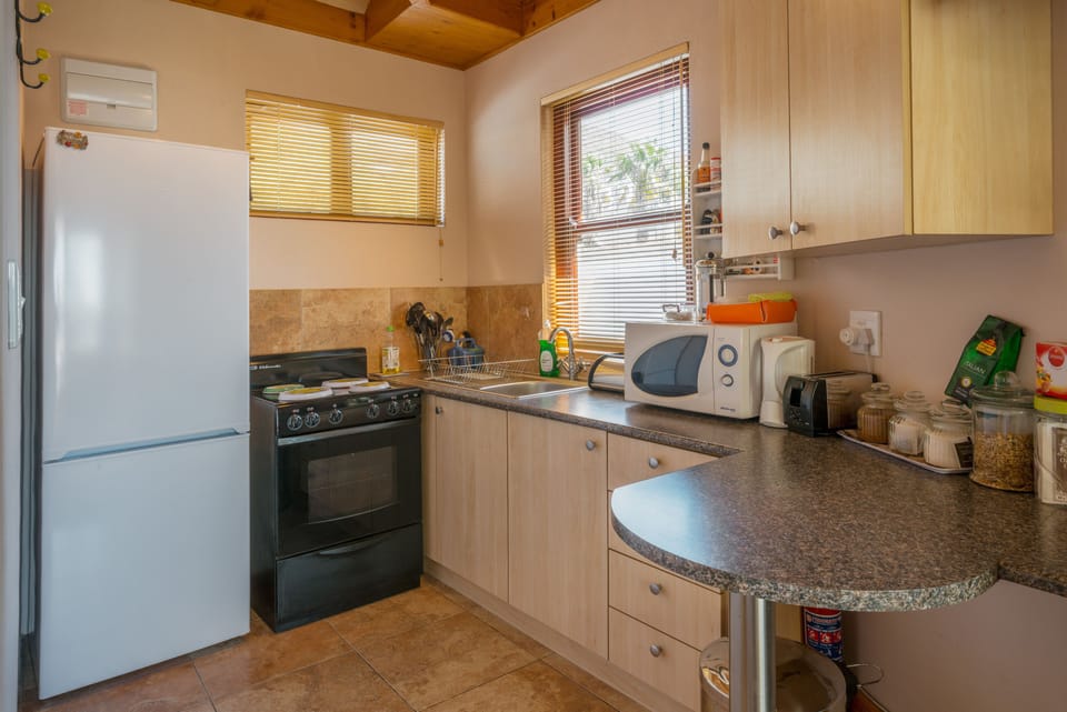 Large Balcony Studio Apartment | Private kitchenette | Fridge, microwave, stovetop, coffee/tea maker