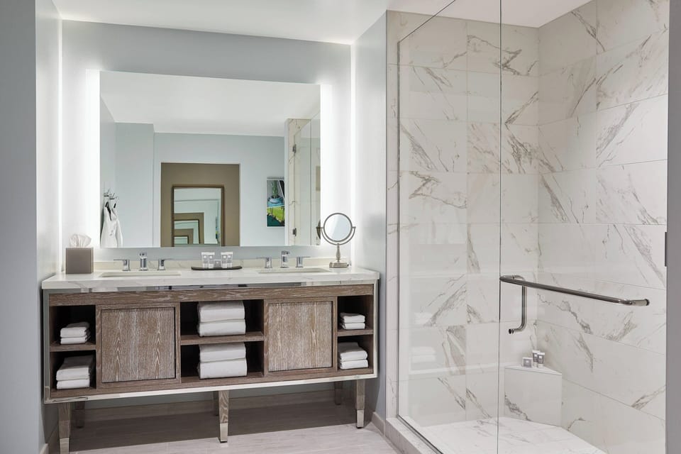 Designer toiletries, hair dryer, bathrobes, towels