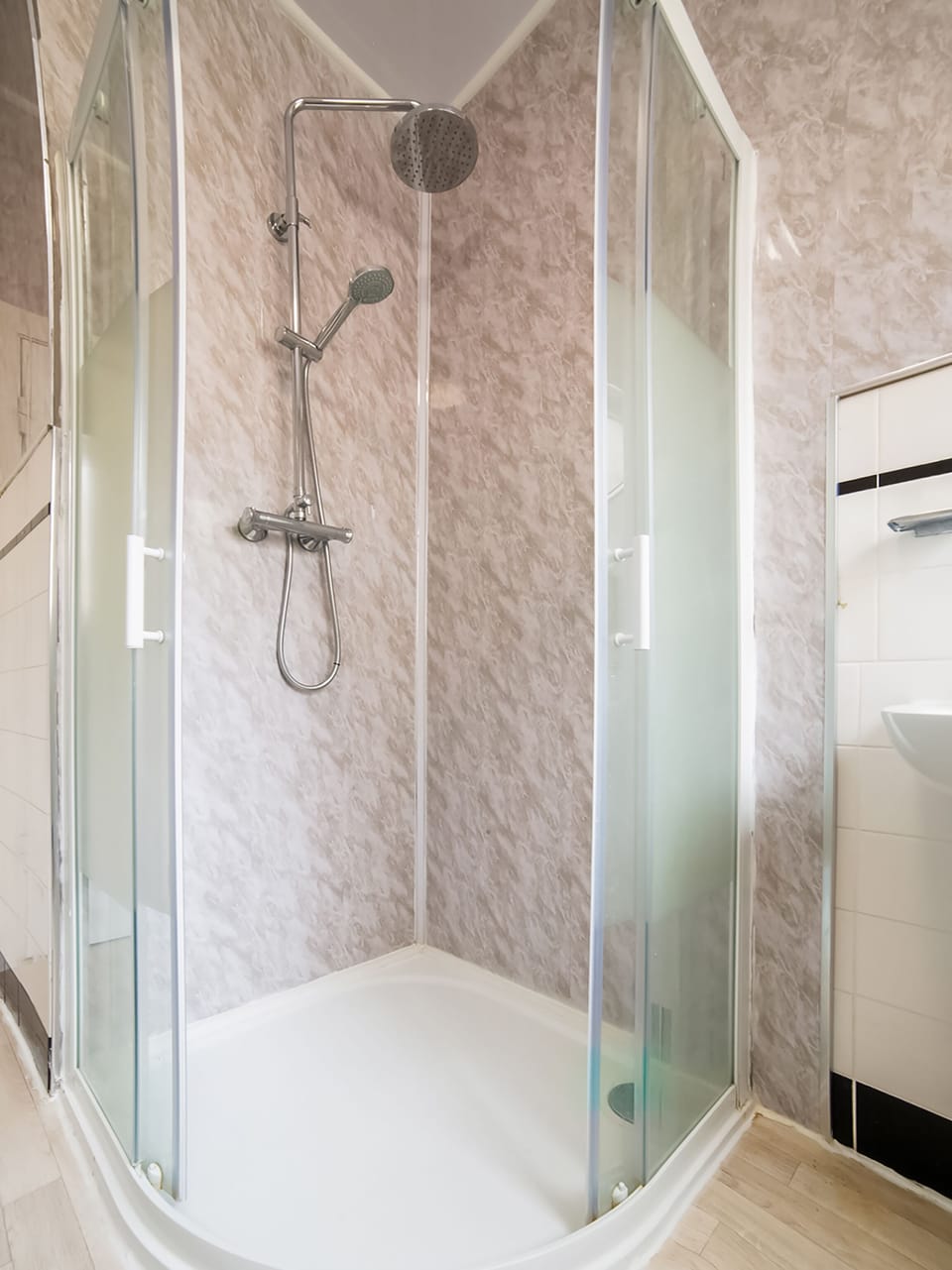 Standard Single Room - Shared | Bathroom | Shower, towels, toilet paper