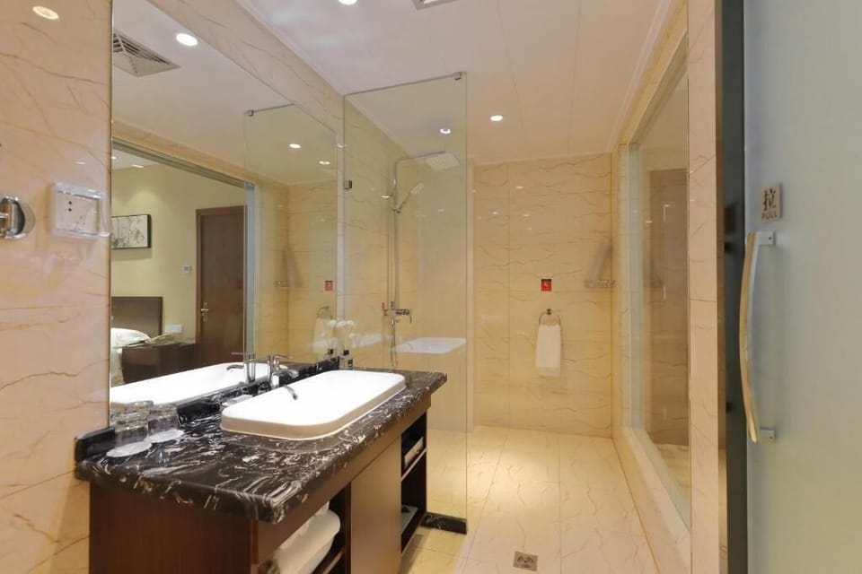 Shower, free toiletries, hair dryer, slippers