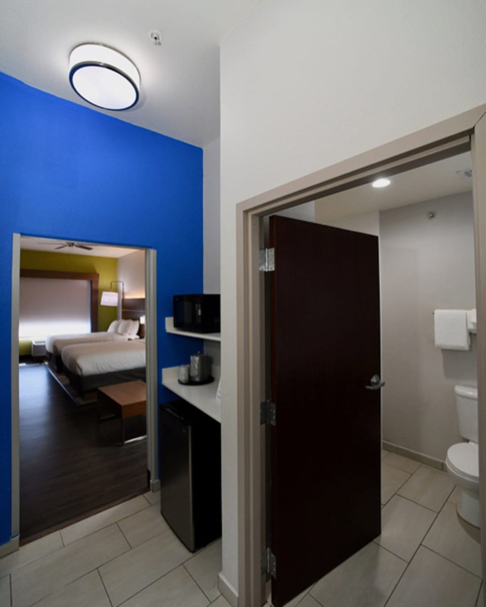 Suite, 2 Queen Beds | In-room safe, desk, iron/ironing board, free cribs/infant beds
