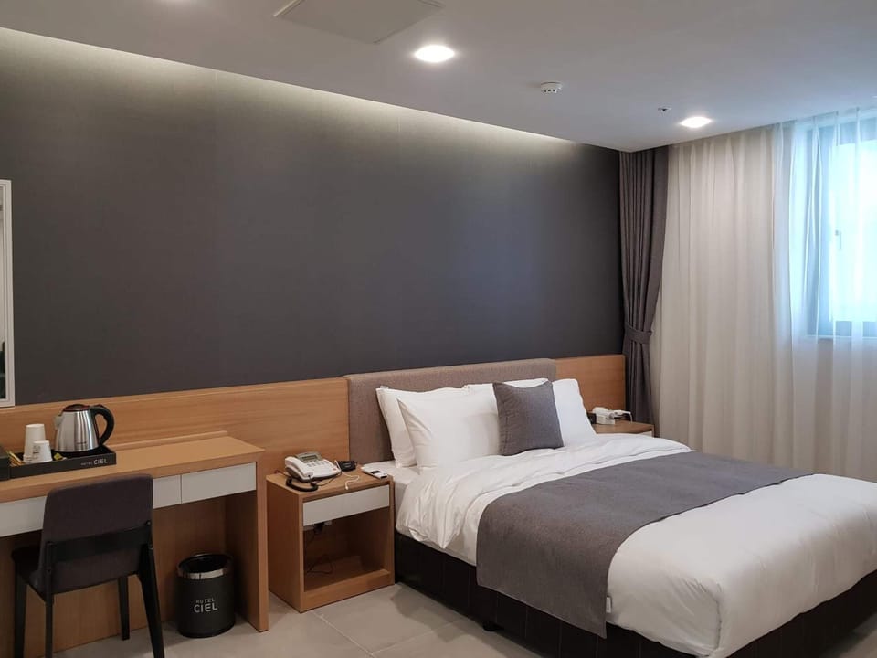 Premium bedding, desk, blackout drapes, iron/ironing board