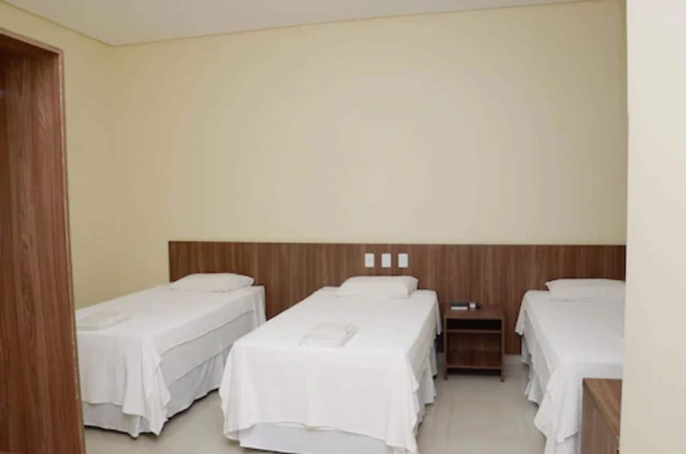 Deluxe Triple Room | Minibar, desk, blackout drapes, iron/ironing board