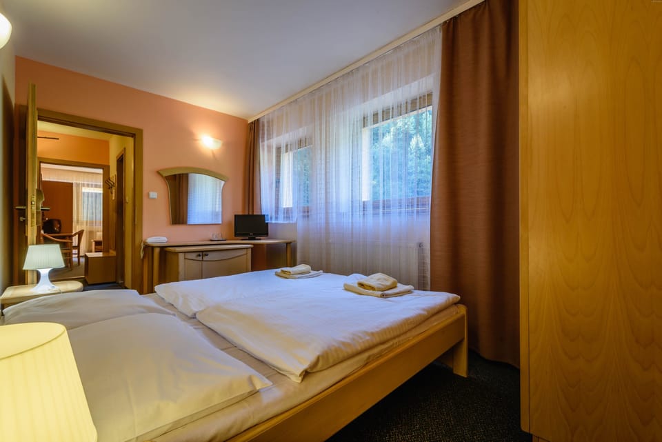 Family Quadruple Room, 2 Bedrooms | In-room safe, blackout drapes, iron/ironing board, free wired internet