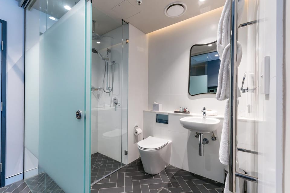 Designer toiletries, hair dryer, towels