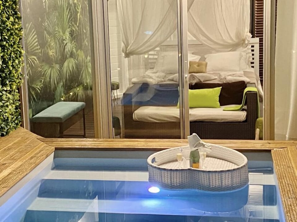 Signature Cabin, Pool View (Cabanon Jungle Paradise) | Hypo-allergenic bedding, minibar, individually decorated, bed sheets