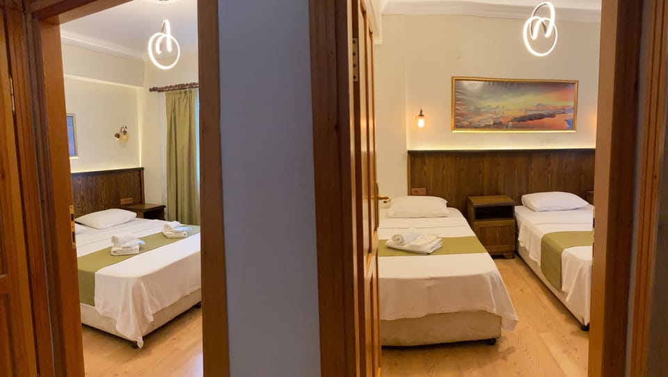 Suite, 2 Bedrooms | Minibar, iron/ironing board, free WiFi, bed sheets
