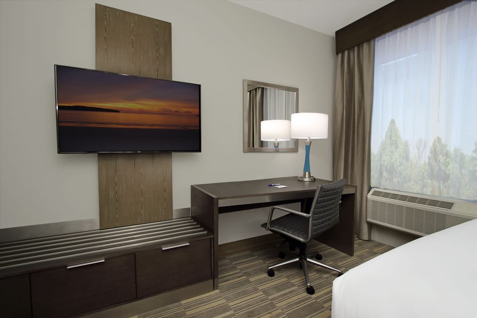 Desk, laptop workspace, blackout drapes, iron/ironing board