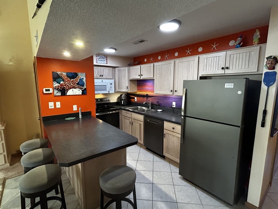 Condo, 1 Bedroom | Private kitchen | Full-size fridge, microwave, coffee/tea maker