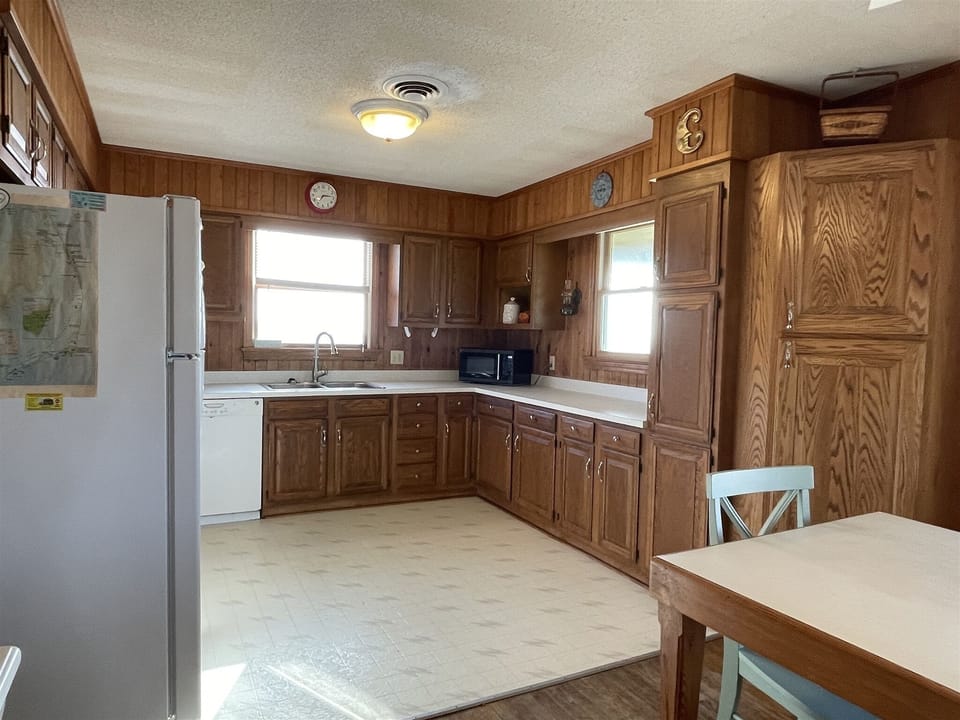 Cottage, 4 Bedrooms | Private kitchen | Full-size fridge, microwave, stovetop, dishwasher