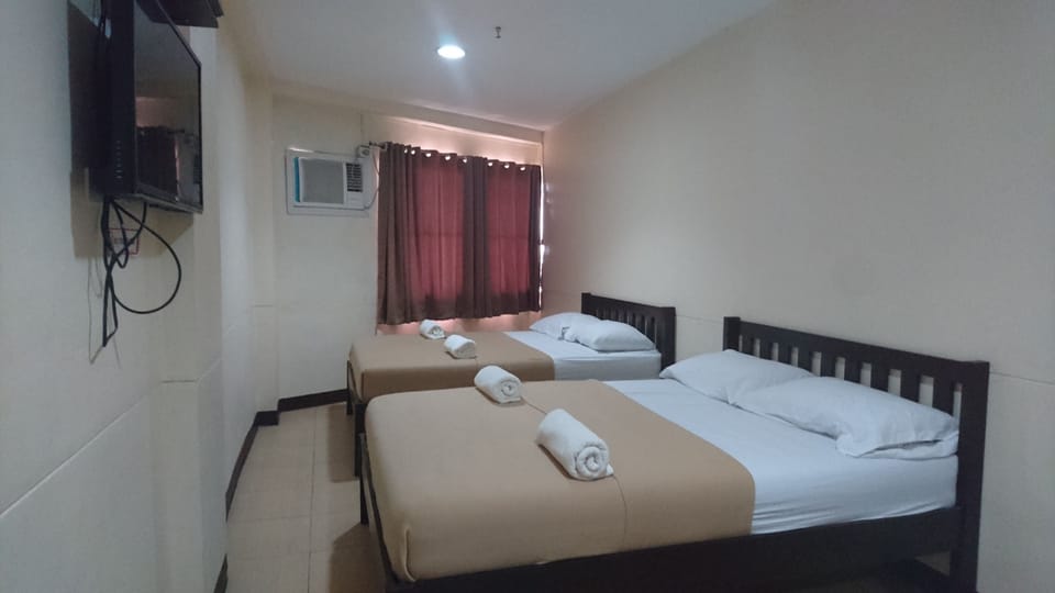 Deluxe Quadruple Room | Iron/ironing board, free WiFi, bed sheets