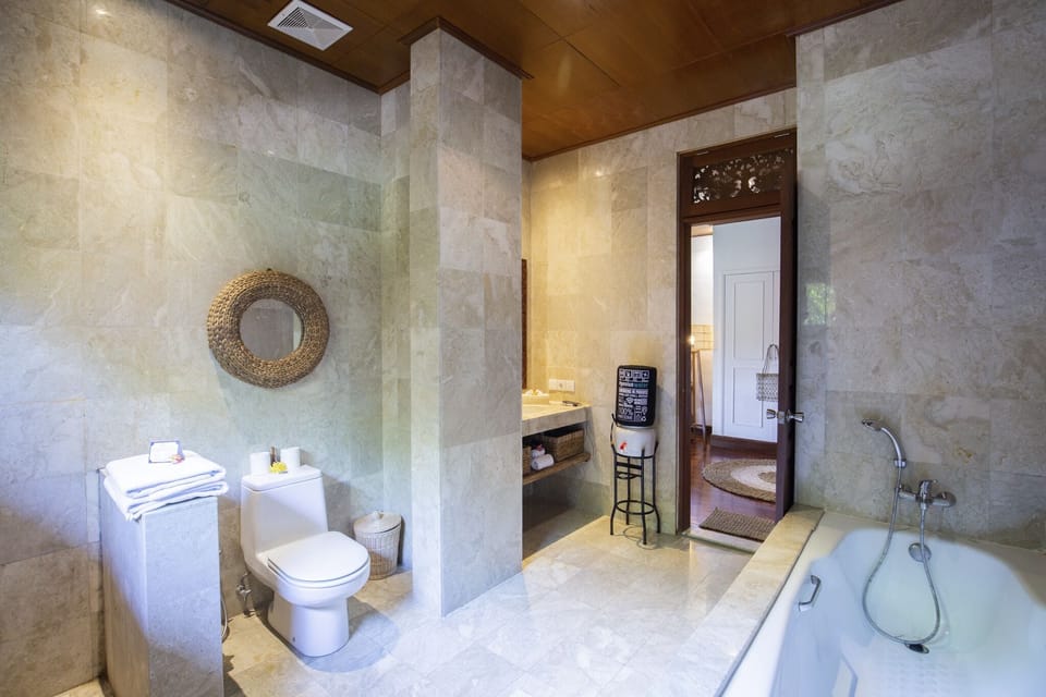 Family Suite, 2 Queen Beds, Garden View | Bathroom | Free toiletries, bathrobes, slippers, towels